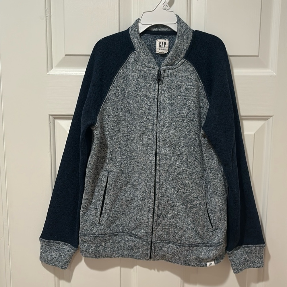 Boys zip up jacket from the gap size medium. Blue and gray colors